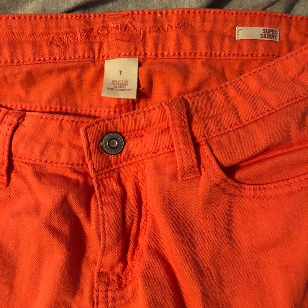 Coral colored skinny jeans